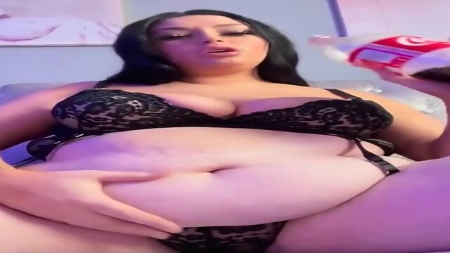 Humungous female with immense bosoms is dressed in softcore, black undergarments while pawing herself on webcam