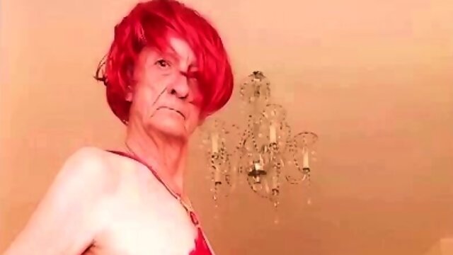 Swinging crossdresser in red robe