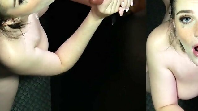 Brunette Emma Indica sucks cock through glory hole with her natural tits