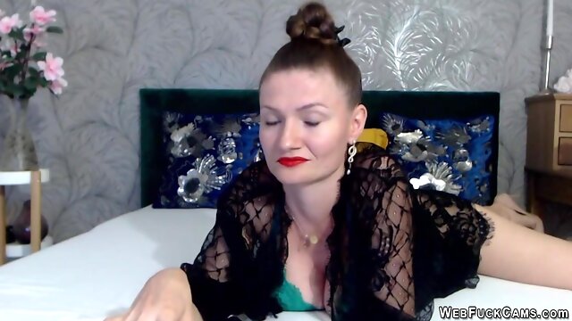 Busty Romanian MILF oiling tits