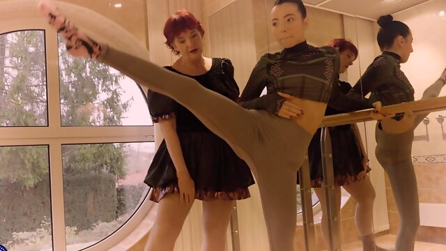 Two mature lesbians, Veri and Mitzi X, passionately enjoying each other.