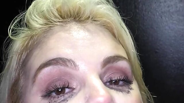 Katy Jayne swallows a load of cum through a glory hole, showcasing her skills.