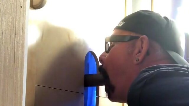 Gloryhole cub impatiently blowing big black cock manstick thru wall