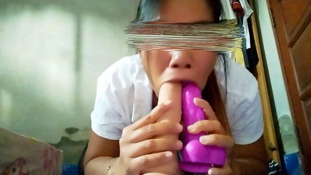 Young Asian Woman Sucks Two Cocks at Once