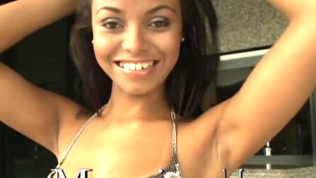 Awesome long-legged brunette Maricella demonstrates her shaved pussy