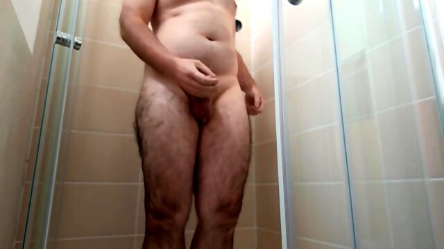 Enjoying a steamy shower while stroking my big pink rod and letting loose with ropes of cum