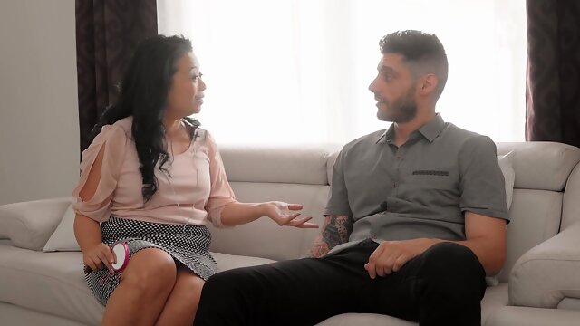 Asian milf Lucky Starr seduces a couple in a steamy miniskirt scene.