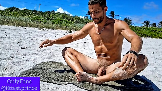 Brazilian jock Andrearmani does nude yoga at a beach in Rio