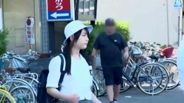 A man targets a girl in a uniform, groping her body and lifting her skirt to touch her buttocks.