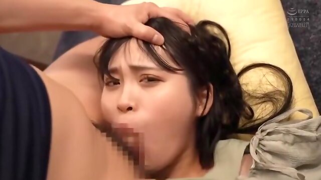 Her legs are spread in an M shape and a vibrator is inserted and removed.