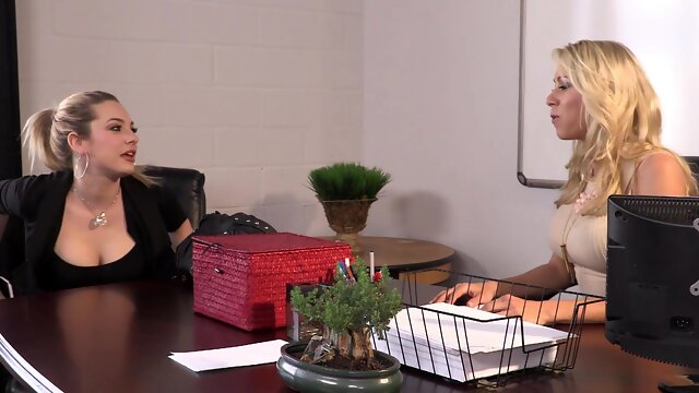 Blonde beauties Morgan and Dahlia Sky enjoy a steamy office encounter