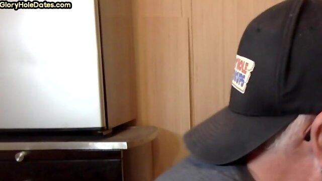 Homemade gloryhole DILF sucks BFs rod through gloryhole