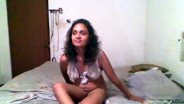 Amusing maid Tina Baby in a sundress gets frisky in the bedroom