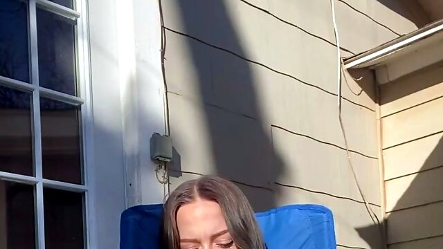 Hot and horny teen having solo fun with a pink toy outside 