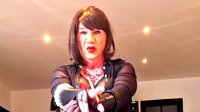 Mature crossdresser smoking in latex outfits
