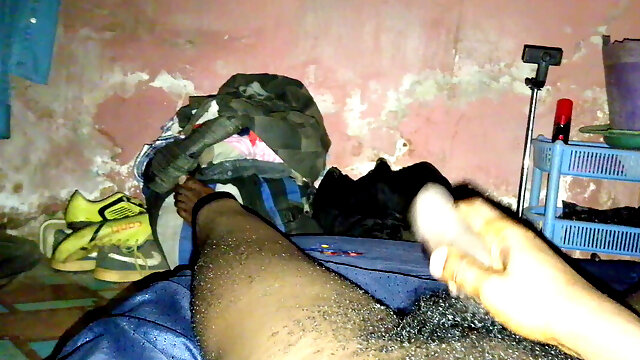 The African dark-hued Guy, Bobby Johnson is just stroking and pawing his hard-on against his laps for fun