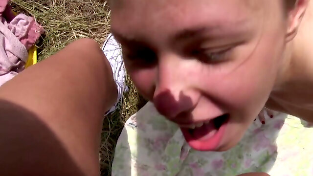 Petite brunettes get mouths on each other out in the grass