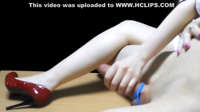 Redhead nurse in stiletto heels teases with her feet and makes him cum twice