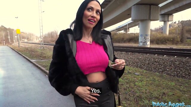 Italian agent Giulia Diamond takes a cumshot in her mouth during a forest blowjob