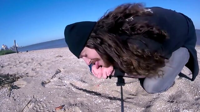 Young brunette teen lets it all hang out on the beach as wind and passion rise