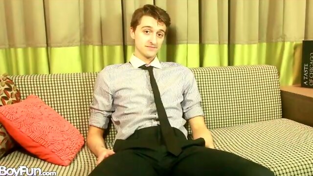 Suave business guy Scott Anders jerks off on a couch