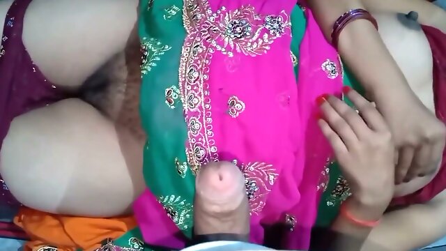 Indian wife in colorful dress enjoys intimate moments with her husband