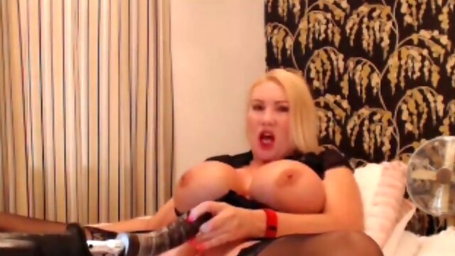 British MILF orgasms with massive toy in lace stockings and heels