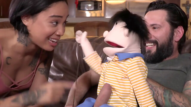Petite Asian babe rides bearded puppet master stud