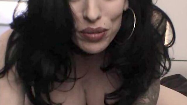 Brunette MILF Domonique Flowers shows her big tits and cums loudly on a glass dildo