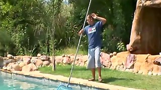 Milf fucks a young man by the pool