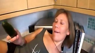 7 minutes of cucumber loving mature in kitchen
