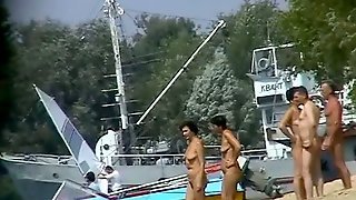 Hot beach voyeur video shows mature nudists enjoying each others company.