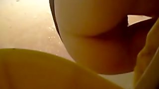 Spy toilet pee cam shot of a cute girl spreading her crutch