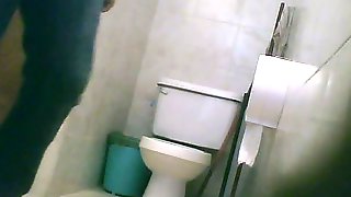 Hidden toilet cam catches chubby Latina chick pissing