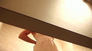 Sexy butted gal waves ass in thong on dressing room spy cam