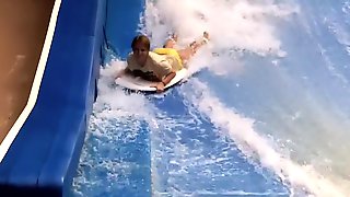 Sexy flowrider is demonstrating her downblouse in aqua park