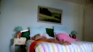 Milf stretching on bed and enjoying spy cam masturbating