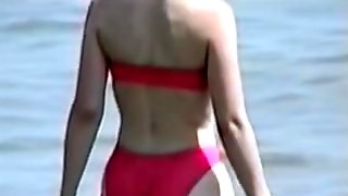 Girl in candid pink bikini coming into the sea water 05zw