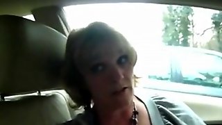 Mature wife gives good suck to man on car