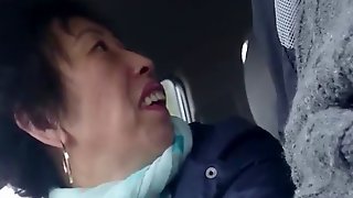 Homemade, older chinese lady wanks cock in car