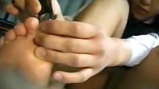 Fetishism - Cute girl cutting the nails on the bet