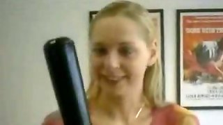 Cute blonde gal tries to shove a baseball bat in her pussy