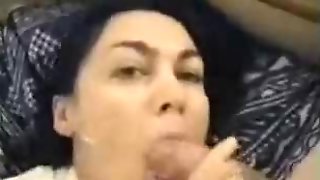 Beautiful brunette jerking a dick until the cum is in her mouth