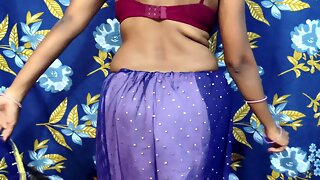 Sensual Indian housewife in blue saree dances with passion