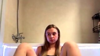 Cute young lady Juicelussie enjoys playing with her toy