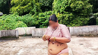 A Full-figured Woman in a White Skirt and Pink Top Strips Down and Walks Nude Outside