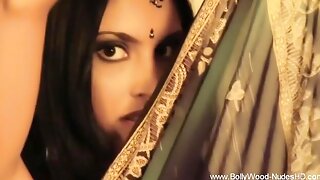 Olive sari with a gold border frames her eyes