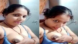 Horny desi bhabhi sucking her boobs