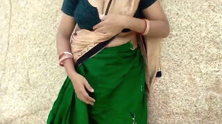 Indian Aunty in green saree bang-out outdoors