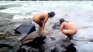 Two indian mature womens  bathing in river naked